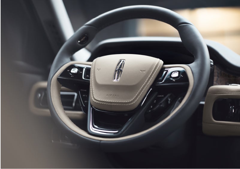 The intuitively placed controls of the steering wheel on a 2023 Lincoln Aviator® SUV | Ted Britt Chantilly Lincoln in Chantilly VA