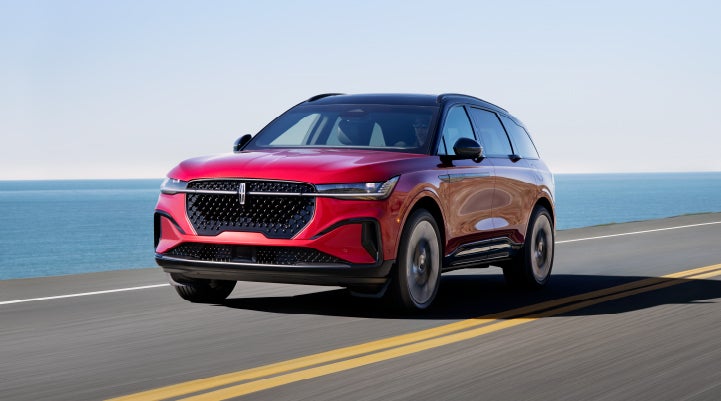 A 2024 Lincoln Nautilus® SUV is being driven on a seaside roadway. | Ted Britt Chantilly Lincoln in Chantilly VA