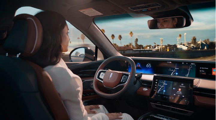 A person is shown driving hands-free on the highway with available Lincoln BlueCruise technology. | Ted Britt Chantilly Lincoln in Chantilly VA