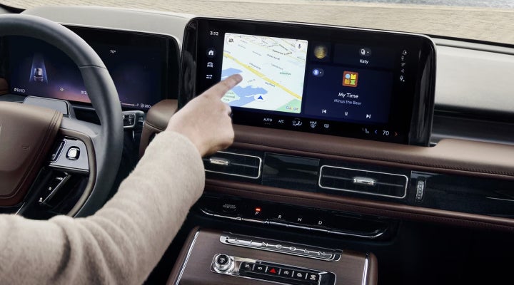 A person is tapping the center display touchscreen of a 2026 Lincoln Aviator® SUV. | Ted Britt Chantilly Lincoln in Chantilly VA