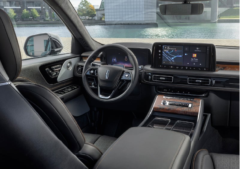 The interior of the 2026 Lincoln Aviator® SUV is shown parked with a view of a harbor through the windshield. | Ted Britt Chantilly Lincoln in Chantilly VA