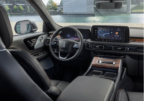 The interior of the 2026 Lincoln Aviator® SUV is shown parked with a view of a harbor through the windshield. | Ted Britt Chantilly Lincoln in Chantilly VA