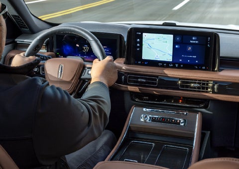 A person is driving a 2026 Lincoln Aviator® SUV as seen from inside the cabin. | Ted Britt Chantilly Lincoln in Chantilly VA