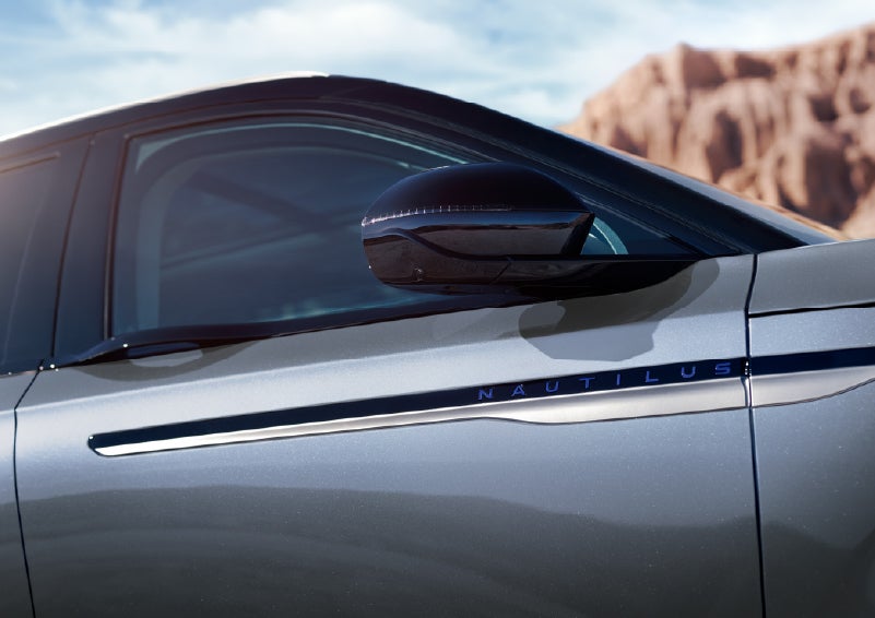 Blue lettering on the side of the vehicle that reads Nautilus indicates the available Hybrid Powertrain. | Ted Britt Chantilly Lincoln in Chantilly VA