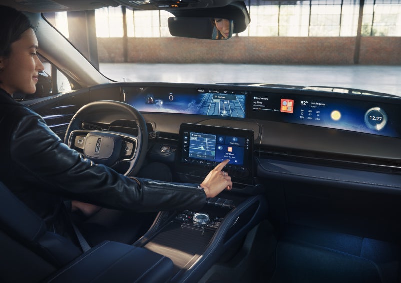 The driver of a 2026 Lincoln Nautilus® SUV interacts with the center touchscreen. | Ted Britt Chantilly Lincoln in Chantilly VA