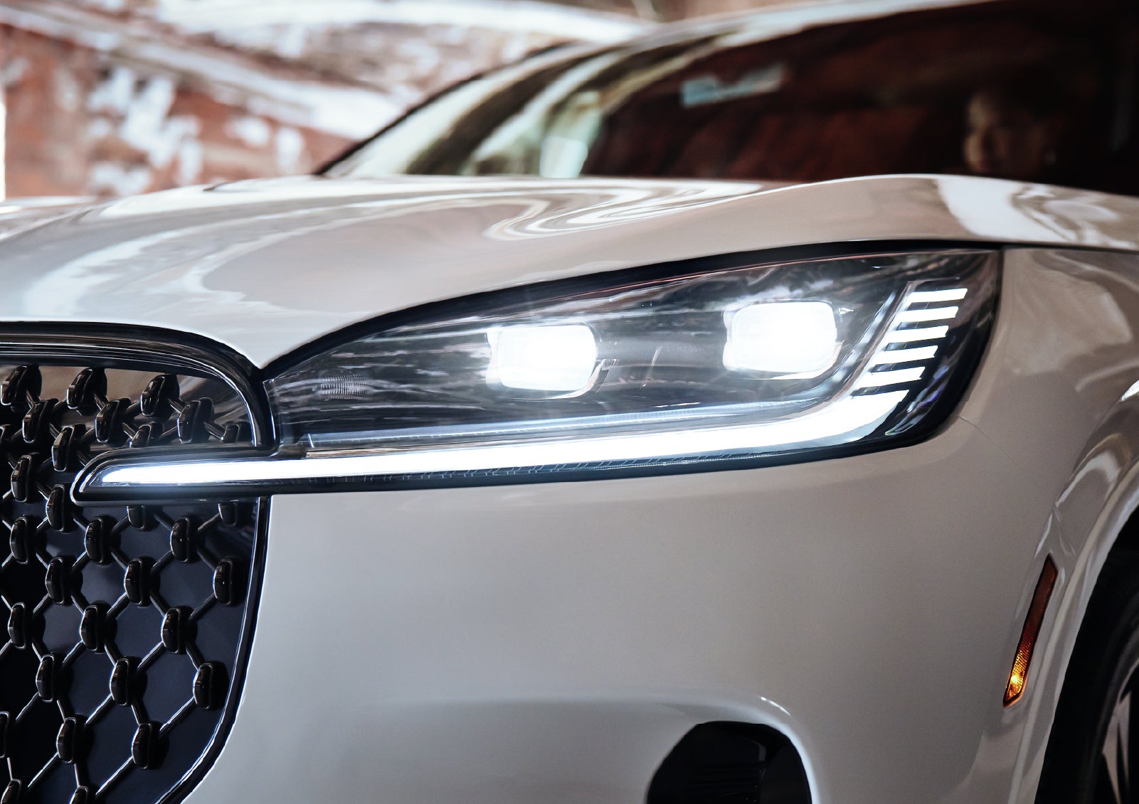A close-up of a headlamp on the 2027 Lincoln Aviator® SUV is shown. | Ted Britt Chantilly Lincoln in Chantilly VA
