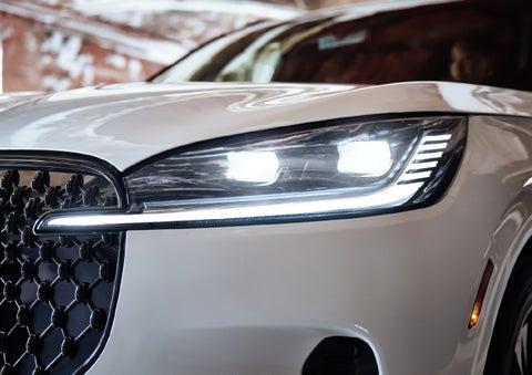 A close-up of a headlamp on the 2027 Lincoln Aviator® SUV is shown. | Ted Britt Chantilly Lincoln in Chantilly VA