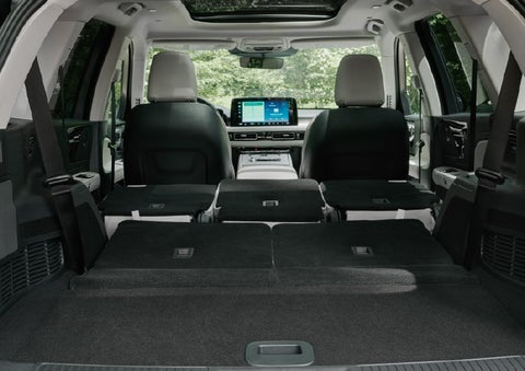 A rear to front view of the interior of a 2027 Lincoln Aviator® Black Label™ SUV shows the third and second rows folded flat | Ted Britt Chantilly Lincoln in Chantilly VA