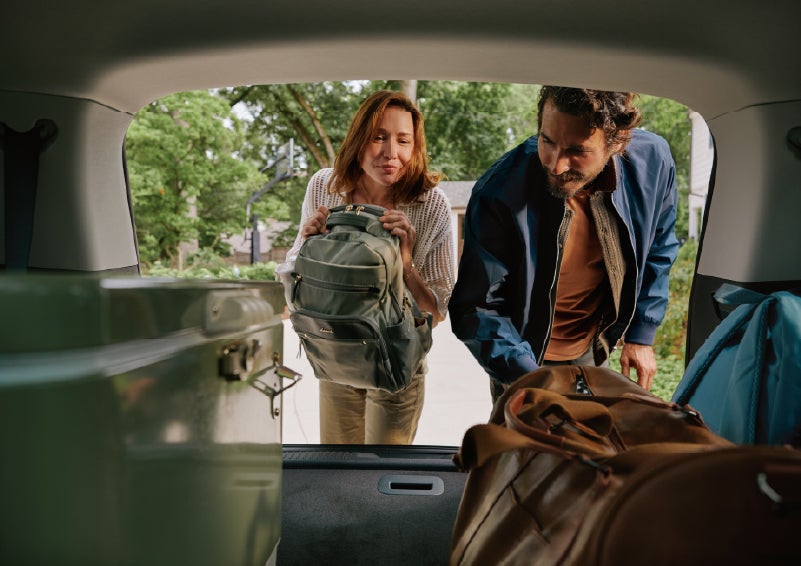 A couple loads luggage into the rear of a 2027 Lincoln Aviator® Black Label™ SUV..e 202 | Ted Britt Chantilly Lincoln in Chantilly VA