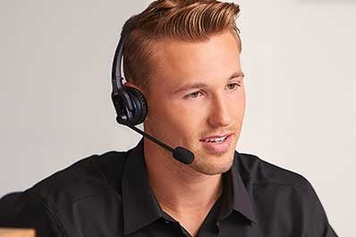 A photo of a Lincoln employee working at the Client Relationship Center.